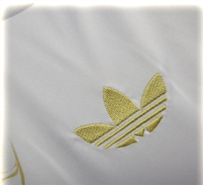 tunique-real-madrid-design-dragon-or-pour-supporter-du-club-version-collector-2425 Túnica Real Madrid design dragão dourado para adepto do clube versão colecionador 2425