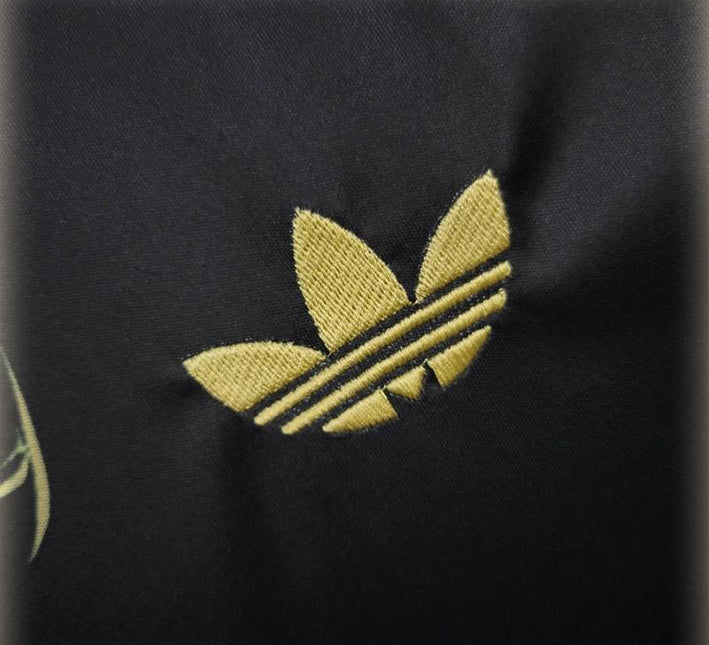 maillot-concept-real-madrid-motif-dragon-dore-edition-2425 Camisola conceito Real Madrid padrão dragão dourado edição 2425