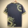 jersey-supporter-real-madrid-style-concept-avec-dragon-dore Camisola adepto Real Madrid estilo conceito com dragão dourado