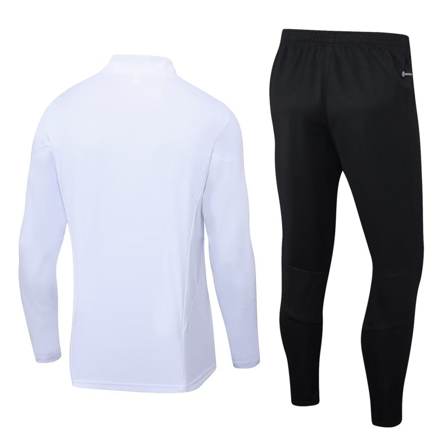 survetement-blanc-manchester-united-saison-2023-2024-veste-et-pantalon Fato de treino branco Manchester United época 2023 2024 casaco e calças