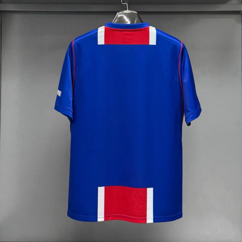 bab43e50a77c5b927380a784114ab9c5_ee979e82-bbb7-4d32-97e5-c5f8dc77ec24.jpg Camisola PSG Principal 26/27 Versão Fã