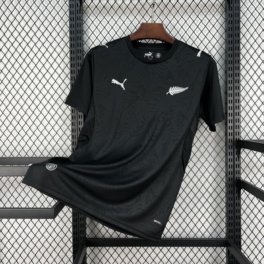 fdb99af3415fb7985f0b5992c0131f76.jpg Camisola Nova Zelândia Alternativa 2026
